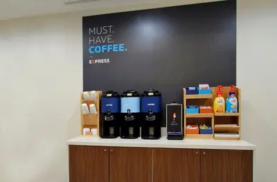 a counter with bottles of coffee on it at Holiday Inn Express Lancaster by IHG in Lancaster