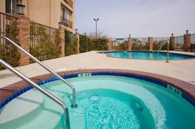 a hot tub in a courtyard with a building at Holiday Inn Express Lancaster by IHG in Lancaster