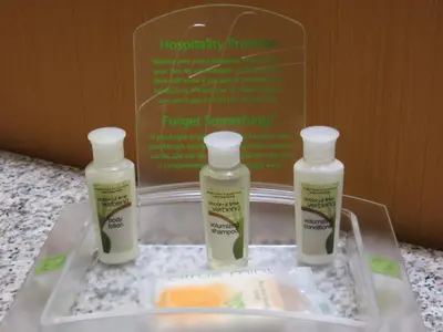 three bottles of moisturizers sitting on a tray on a counter at Holiday Inn Express Lancaster by IHG in Lancaster