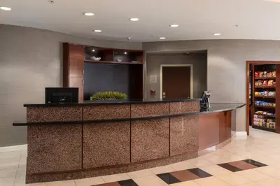 a lobby with a bar in a hotel at Courtyard by Marriott Ontario Rancho Cucamonga in Rancho Cucamonga