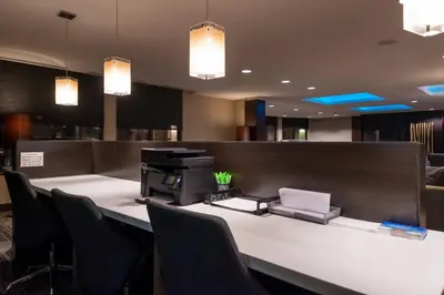 an office with a desk with a printer and chairs at Courtyard by Marriott Victorville Hesperia in Hesperia