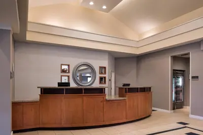 a large lobby with a round mirror on the wall at Residence Inn by Marriott Camarillo in Camarillo