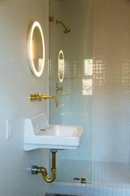 a bathroom with a sink and a glass shower at Hotel June Malibu in Malibu