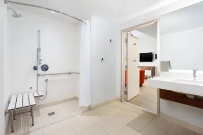 a bathroom with a shower and a sink at Courtyard by Marriott Santa Monica in Los Angeles