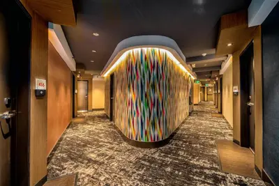 a hallway with a colorful wall in a hotel at Century Park Hotel LA in Los Angeles