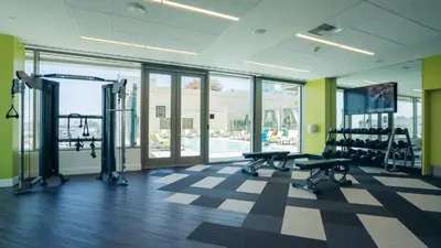 a gym with treadmills and machines in a building at Hotel Indigo Los Angeles Downtown by IHG in Los Angeles