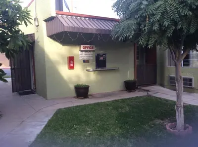 a building with a fire sign on the side of it at Victory Motel Inn near Universal & Hollywood in Glendale