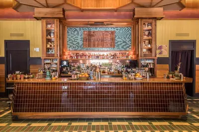 a bar at a restaurant with a brown counter at Freehand Los Angeles in Los Angeles