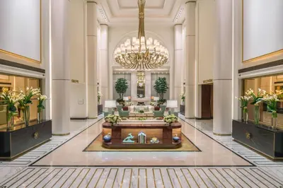 a lobby of a hotel with a chandelier at Waldorf Astoria Beverly Hills in Los Angeles