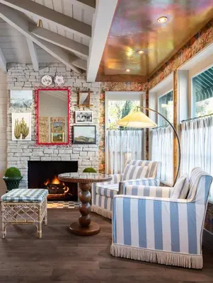 a living room with a couch and a fireplace at Le Petit Pali Brentwood in Los Angeles