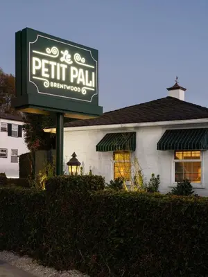 a sign for a petit pail restaurant at Le Petit Pali Brentwood in Los Angeles