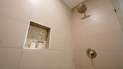 a bathroom with a shower with a window at El Royale Gardens Near Universal Studios in Los Angeles