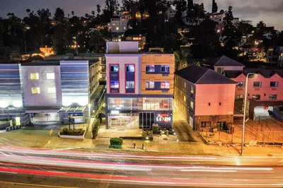 a city at night with traffic and buildings at Lexen Hotel - Hollywood Walk of Fame-Universal Studios in Los Angeles