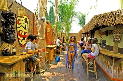 a group of people sitting outside of a bar at Banana Bungalow Hollywood Hotel & Hostel in Los Angeles