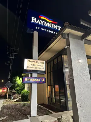 a bank sign in front of a building at Baymont by Wyndham Bakersfield in Bakersfield