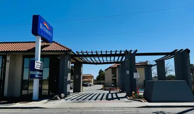 a gas station with a sign in front of it at Baymont by Wyndham Bakersfield in Bakersfield