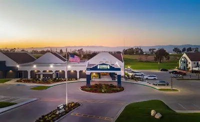 an aerial view of a building with a parking lot at Staybridge Suites Oxnard - River Ridge by IHG in Oxnard