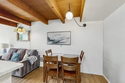 a kitchen and living room with a table and chairs at Sugar Shack in Carpinteria