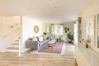 a living room with a couch and a table at Noon on Sunset Hill in Los Angeles