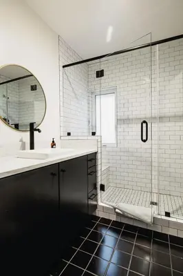 a bathroom with a sink and a shower with a mirror at Noon on Sunset Hill in Los Angeles
