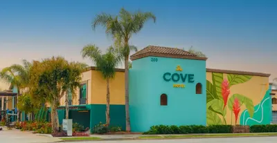 a blue building with the word cove on it at The Cove Hotel in Long Beach