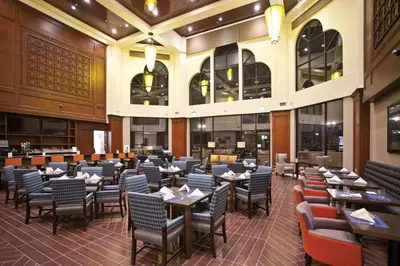 a dining room with tables and chairs in a restaurant at DoubleTree by Hilton Rosemead in Rosemead