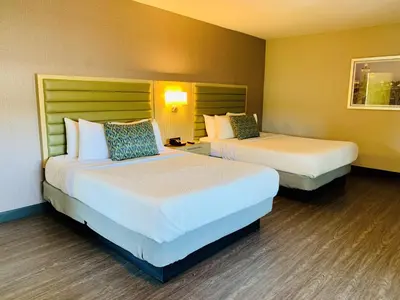 a hotel room with two beds in a room at GreenTree Pasadena in Pasadena