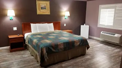 a hotel room with a bed and a window at Hollywood Stars Inn in Los Angeles