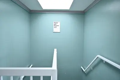 a room with a crib and a sign on the wall at Hollywood Stars Inn in Los Angeles