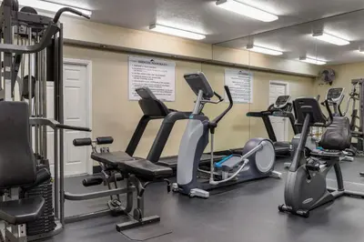 a gym with several treadms and cardio machines at Club Wyndham Dolphin's Cove in Anaheim