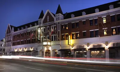 a building on a city street at night at Hollywood Historic Hotel in Los Angeles