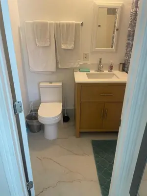 a bathroom with a toilet and a sink at The Village in North Hollywood