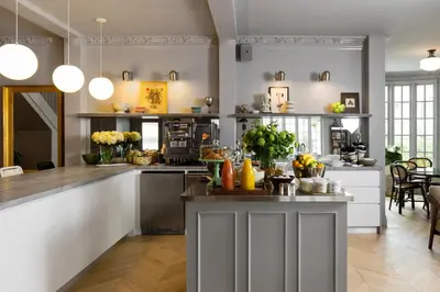 a kitchen with white cabinets and a counter top at Palihotel Westwood Village - West Beverly Hills in Los Angeles