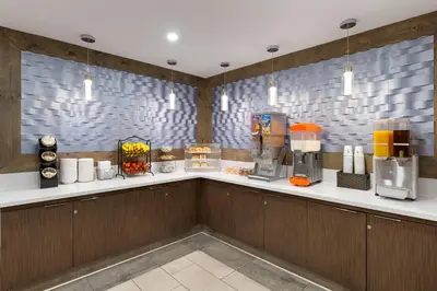 a counter in a restaurant with a coffee shop at Travelodge Inn & Suites by Wyndham Anaheim on Disneyland Dr in Anaheim