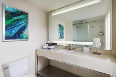 a bathroom with a sink and a mirror at Ocean View Hotel in Los Angeles