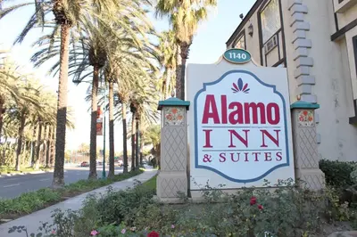 a sign for the alamo inn and suites at Alamo Inn and Suites - Convention Center in Anaheim