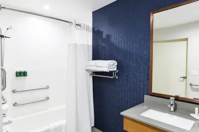 a bathroom with a sink and a mirror at Fairfield Inn & Suites Ontario Rancho Cucamonga in Rancho Cucamonga