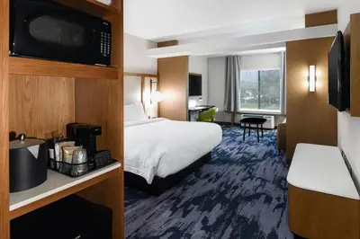 a hotel room with a bed and a television at Fairfield Inn & Suites Ontario Rancho Cucamonga in Rancho Cucamonga