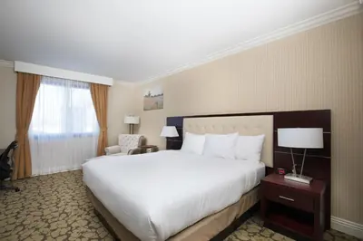 a hotel room with a large bed and a window at Holiday Inn El Monte - Los Angeles by IHG in El Monte