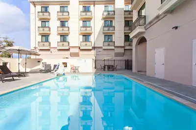 a swimming pool in front of a hotel at Holiday Inn El Monte - Los Angeles by IHG in El Monte