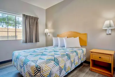 a hotel room with a bed and a window at Studio 6-Bakersfield, CA in Bakersfield