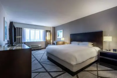 a hotel room with a large bed and a television at DoubleTree by Hilton Los Angeles Norwalk in Norwalk