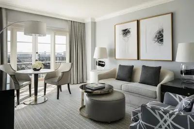 a living room with a couch and a table at Four Seasons Hotel Los Angeles at Beverly Hills in Los Angeles