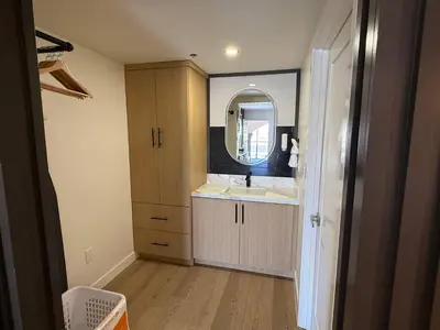 a bathroom with a sink and a mirror at MainStay Suites Victorville - Hesperia in Victorville