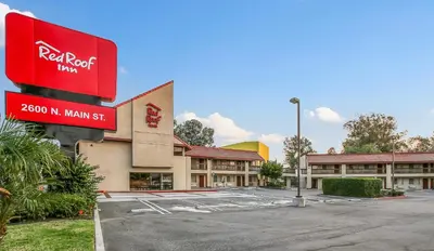 a parking lot in front of a red roof inn at Red Roof Inn Santa Ana in Santa Ana