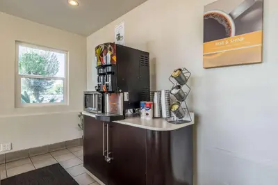 a kitchen with a counter with a coffee bar at Motel 6-Redlands, CA in Redlands