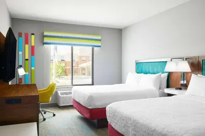 a hotel room with two beds and a window at Hampton Inn & Suites Ridgecrest in Ridgecrest