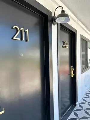 a door with the number on the side of a building at Anaheim Maingate Inn in Anaheim