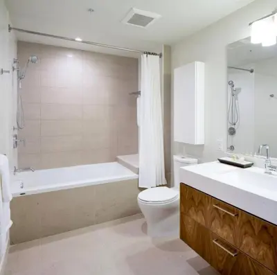 a bathroom with a tub and a toilet and a sink at Luxurious Highrise 2b 2b Apartment Heart Of Downtown LA in Los Angeles