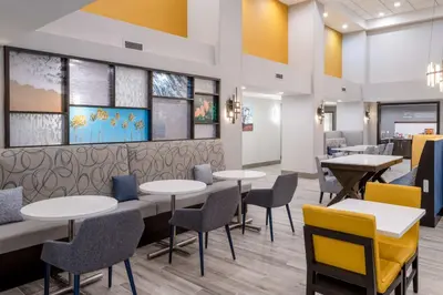 a dining room with tables and chairs at Hampton Inn & Suites Agoura Hills in Agoura Hills